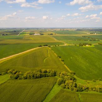 An aerial image of green farm fields