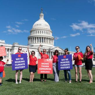 Members of Moms Clean Air Force, which is affiliated with EDF, celebrate the Inflation Reduction Act on Capitol Hill.
