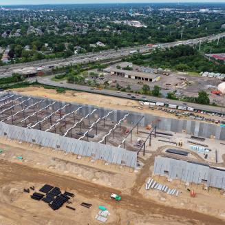 In this aerial view, construction continues on an Amazon last-mile warehouse that is being erected on the former site of Cerro Wire on August 20, 2021 in Syosset, New York