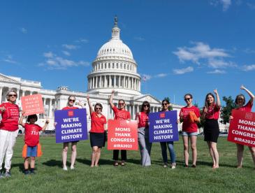 Members of Moms Clean Air Force, which is affiliated with EDF, celebrate the Inflation Reduction Act on Capitol Hill.